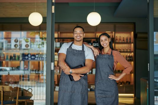 2 small business owners in smocks